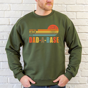 A man wearing a green sweatshirt with a graphic design on it.