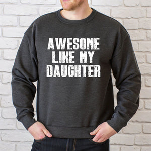 A man wearing a grey sweatshirt with the text "AWESOME LIKE MY DAUGHTER" printed on it.