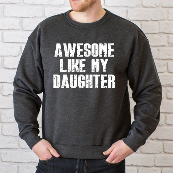 A man wearing a grey sweatshirt with the text "AWESOME LIKE MY DAUGHTER" printed on it.