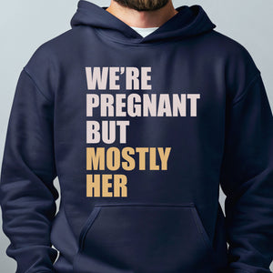 A man wearing a navy blue hoodie with text printed on it.