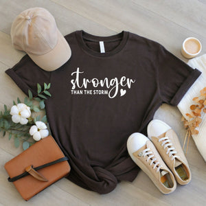Stronger Than The Storm – Resilience Tee for Fighters & Survivors