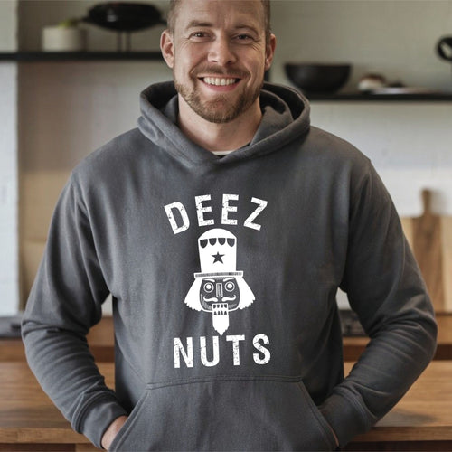 A man wearing a heather dark grey hoodie with the text "DEEZ NUTS" printed on it, smiling at the camera.