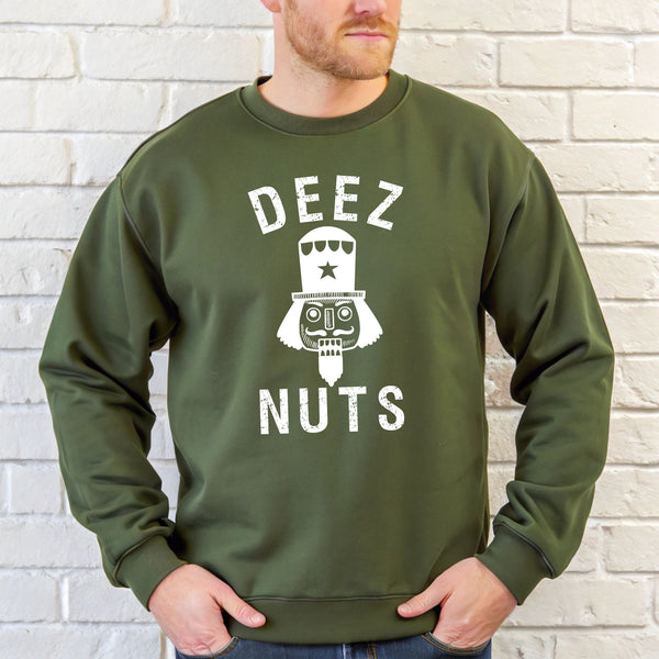 A man wearing a military green sweatshirt with the text "DEEZ NUTS" printed on it.