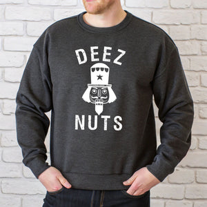 A man wearing a heather dark grey sweatshirt with the text "DEEZ NUTS" printed on it.
