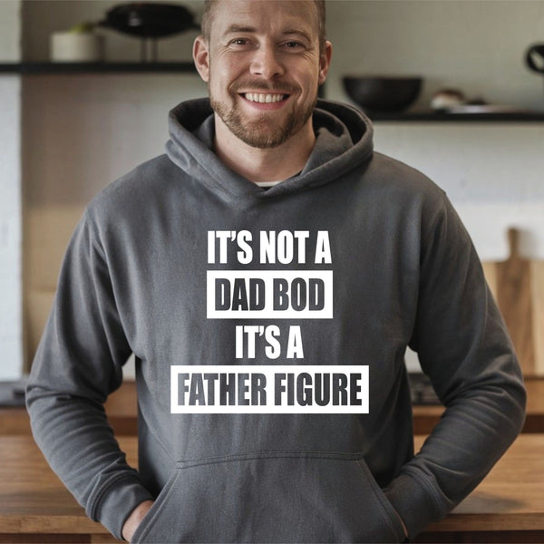 A man wearing a grey hoodie with the text "IT'S NOT A DAD BOD IT'S A FATHER FIGURE" printed on it.