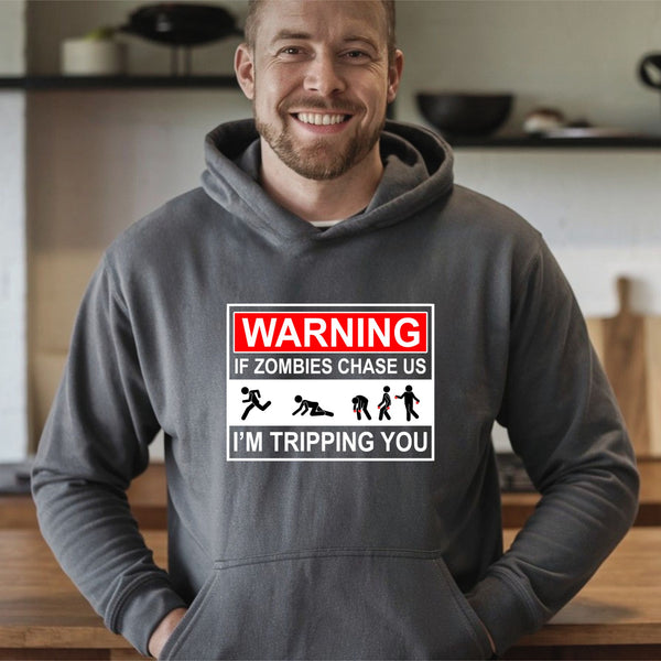 A man wearing a gray hoodie with a warning graphic printed on it.