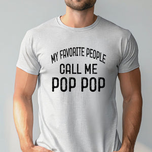 A man wearing a gray t-shirt with the text "MY FAVORITE PEOPLE CALL ME POP POP" printed on it.