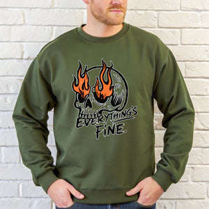 A man wearing a green sweatshirt with a graphic design featuring a skull with flames and the text "Everything's Fine" printed on it.