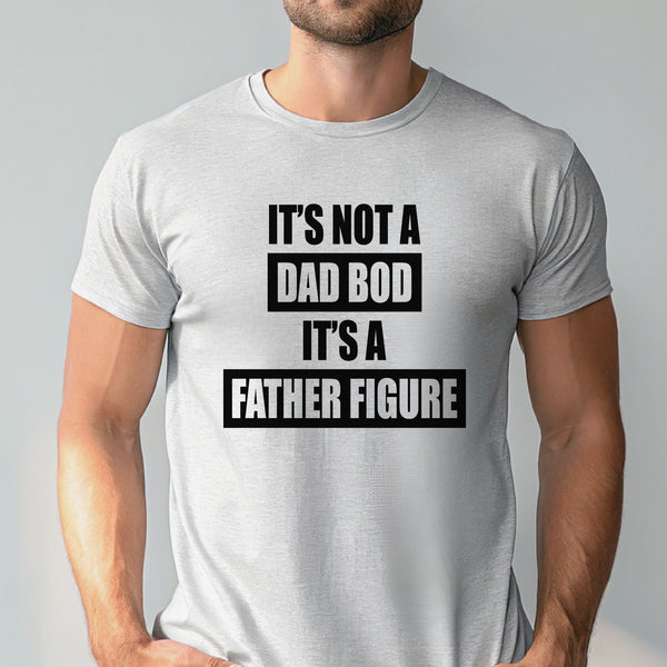A man wearing a gray t-shirt with the text "IT'S NOT A DAD BOD IT'S A FATHER FIGURE" printed on it.