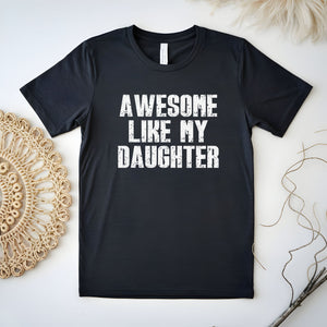 A black t-shirt with the text "AWESOME LIKE MY DAUGHTER" printed on it.