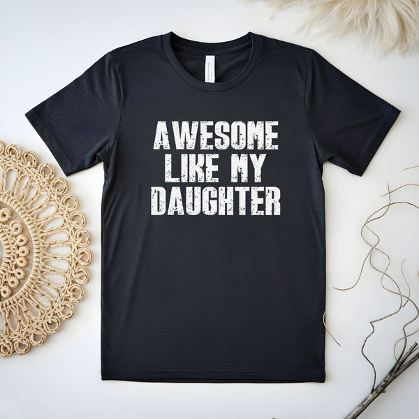 A black t-shirt with the text "AWESOME LIKE MY DAUGHTER" printed on it.