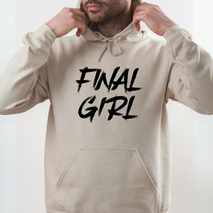 A man wearing a beige hoodie with the text "Final Girl" printed on it.