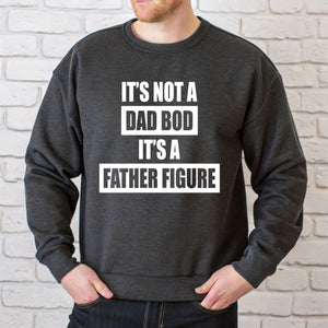 A man wearing a grey sweatshirt with the text "IT'S NOT A DAD BOD IT'S A FATHER FINE" printed on it.