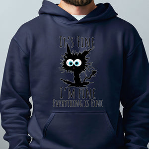 A navy blue hoodie with a graphic design featuring a black cat with large eyes and a speech bubble saying "It's fine I'm fine everything is fine".