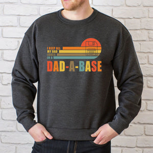 A man wearing a gray sweatshirt with a graphic design on it.