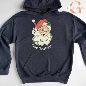 A gray hoodie with a graphic of a smiling Santa Claus wearing a red hat and the text "Merry Christmas" printed on it.