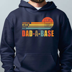 A navy blue hoodie with a graphic design that says "I keep all my dad hangs in a DAD-A-BASE" and features a computer hard drive icon.