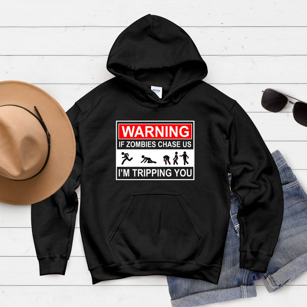 A black hoodie with a humorous graphic design, a pair of sunglasses, and a hat are laid out on a white background.