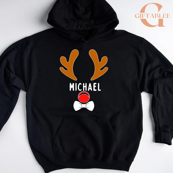 A black hoodie with a graphic design featuring a pair of orange antlers and the name "MICHAEL" printed on it.