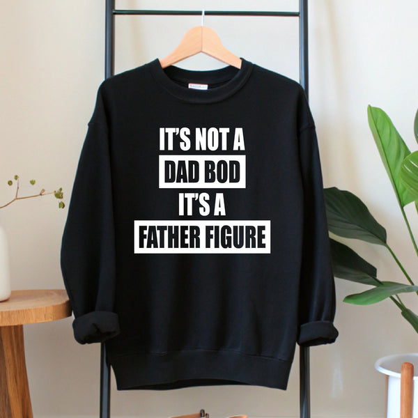 A black sweatshirt with white text printed on it, hanging on a wooden hanger.