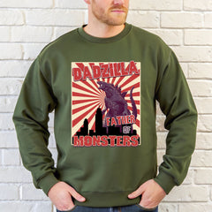 A man wearing a green sweatshirt with a graphic design featuring a large image of a monster and the text "DADZILLA FATHER OF MONSTERS".