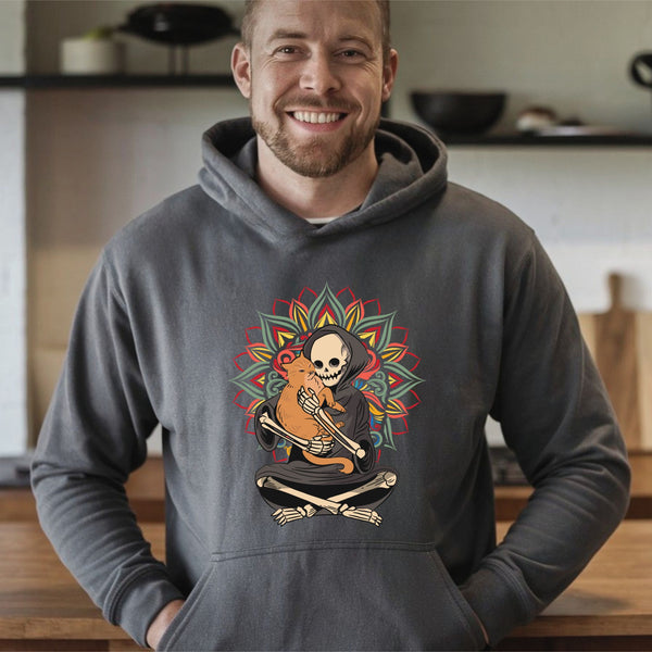 A man wearing a gray hoodie with a graphic design of a skeleton holding a cat.