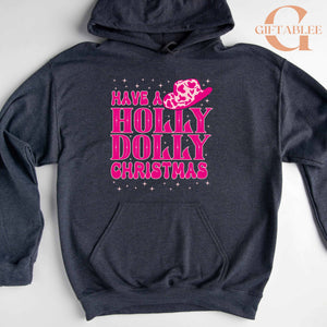 A dark grey hoodie with a pink and purple design that says "Have a Holly Dolly Christmas" on it.