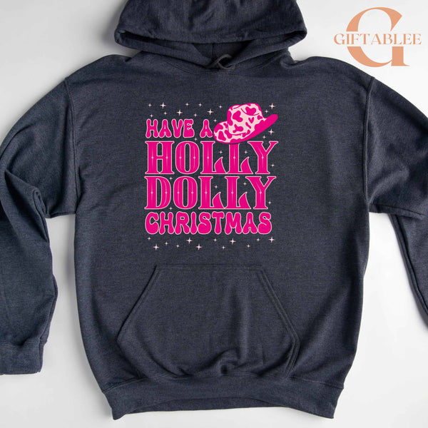 A dark grey hoodie with a pink and purple design that says "Have a Holly Dolly Christmas" on it.