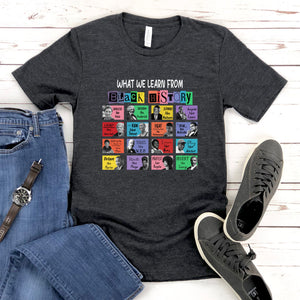 a gray t-shirt with a graphic design of various colorful icons and text, along with a pair of jeans and sneakers, all laid out on a wooden surface.