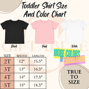 The image is a toddler shirt size and color chart, displaying three different colored t-shirts (black, pink, white) along with their corresponding sizes and widths.