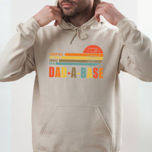 A man wearing a beige hoodie with a graphic design on it.