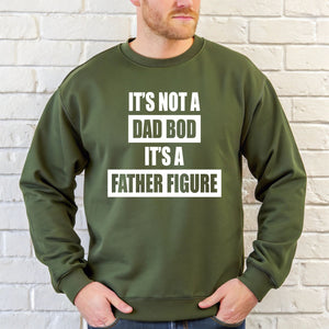 A man wearing a green sweatshirt with the text "IT'S NOT A DAD BOD IT'S A FATHER FOUNDATION" printed on it.