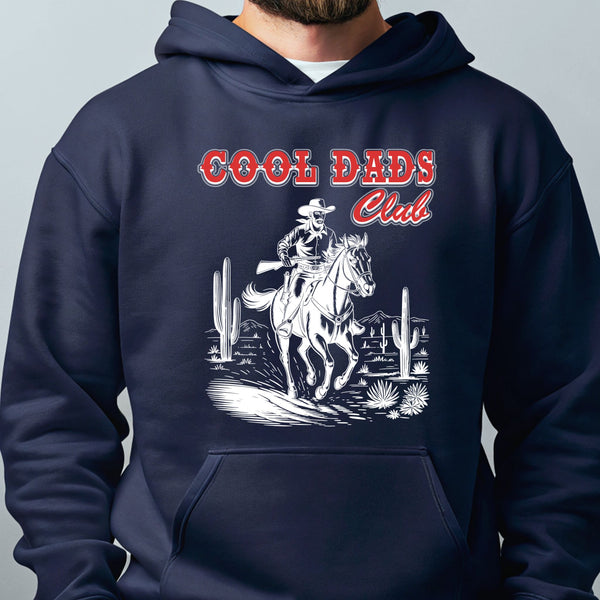 A navy blue hoodie with a graphic design depicting a cowboy riding a horse in a desert landscape, with the text "Cool Dads Club" above the image.
